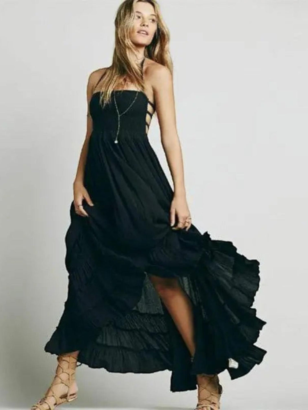 Woman wearing Black Backless Halter Maxi Dress with ruffled, halter | Lunova