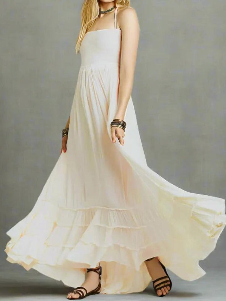 Woman wearing White Backless Halter Maxi Dress with ruffled, halter | Lunova