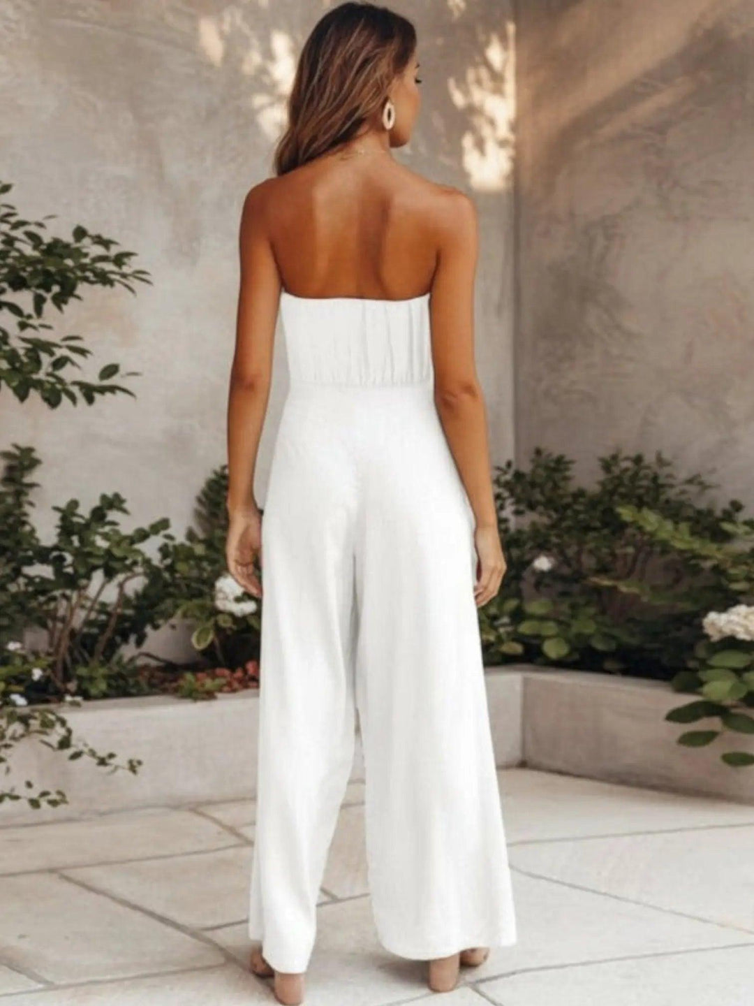 Woman wearing Backless Jumpsuit with full-length, wide-leg — view 2 | Lunova