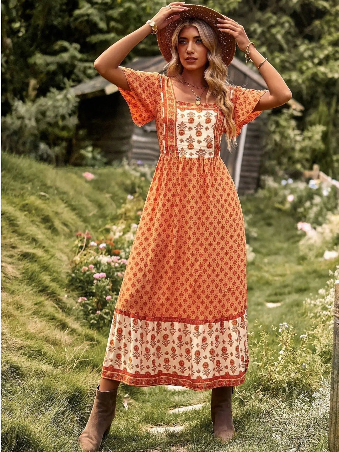 Woman wearing Orange Bohemian Maxi Dress with ruffled, floral print | Lunova