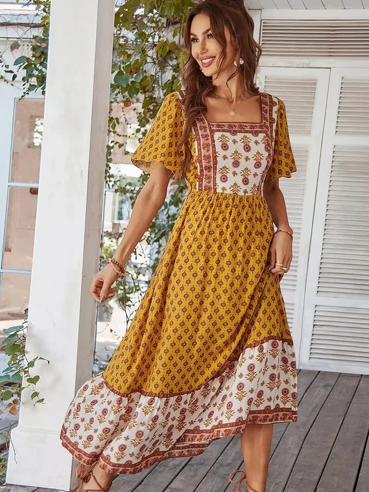 Woman wearing Bohemian Maxi Dress with ruffled, floral print — view 5 | Lunova