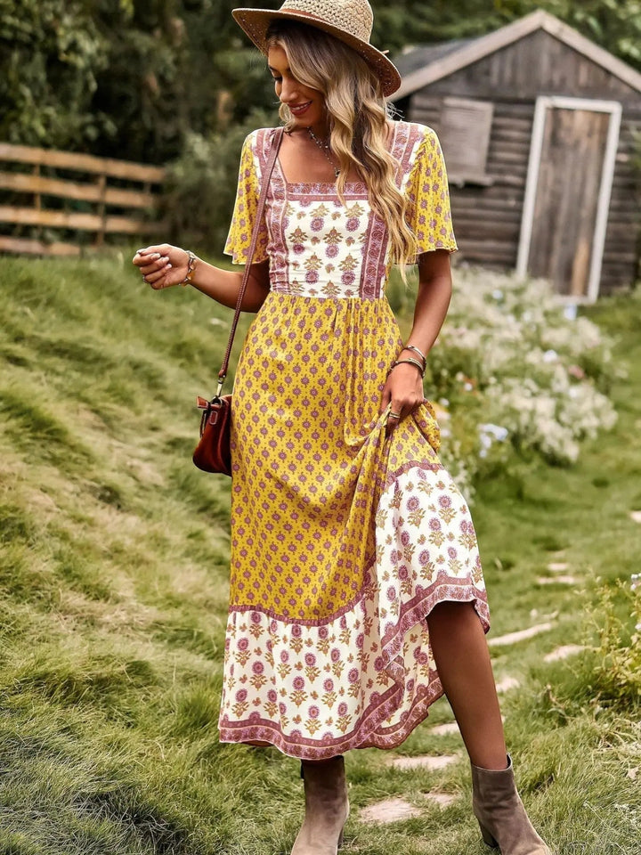 Woman wearing Yellow Bohemian Maxi Dress with ruffled, floral print | Lunova