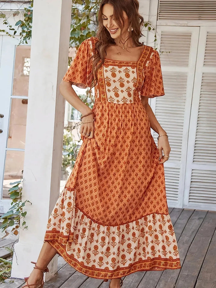Woman wearing Bohemian Maxi Dress with ruffled, floral print | Lunova