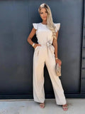Woman wearing Champagne Chic Jumpsuit with ruffled, full-length | Lunova