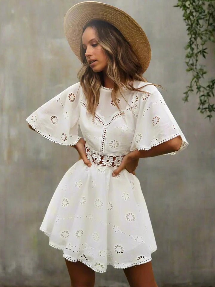 Woman wearing White Chic Mini Dress with A-line, empire-waist | Lunova