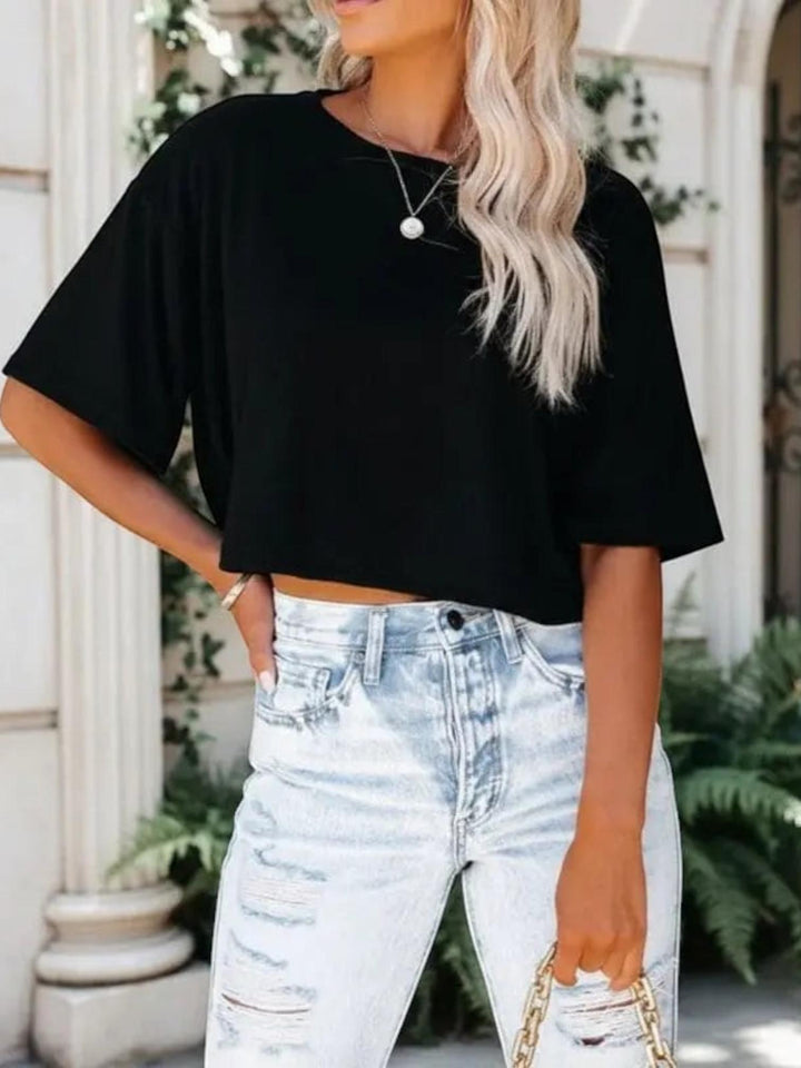 Woman wearing Black Crop T-Shirt with crew-neck, cropped | Lunova