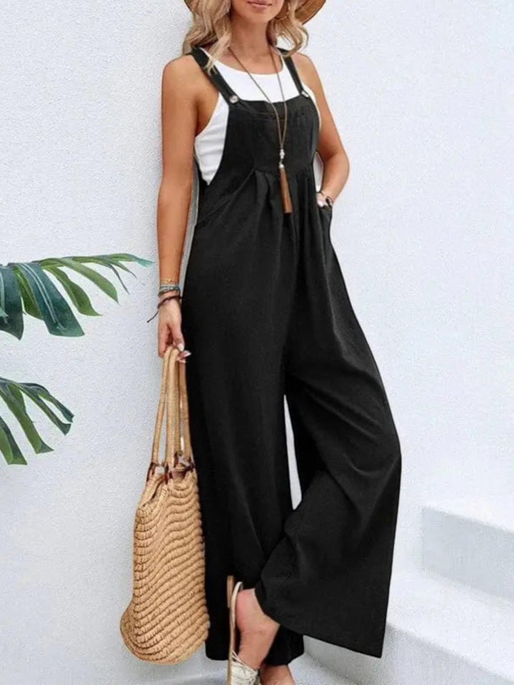 Woman wearing Black Flare Leg Jumpsuit Overall with drawstring, relaxed | Lunova