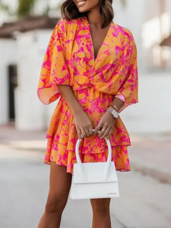 Woman wearing Orange Floral Mini Dress with A-line, empire-waist | Lunova