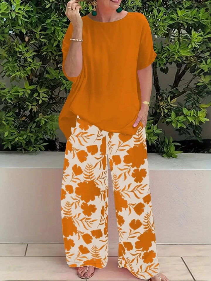 Woman wearing Orange Floral Two-Piece Set with wide-leg | Lunova