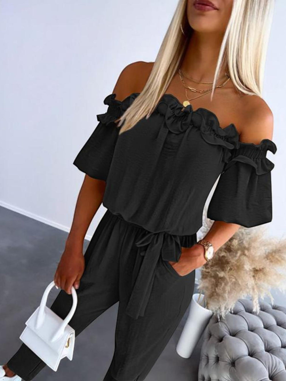 Woman wearing Black Off Shoulder Jumpsuit with off-shoulder | Lunova