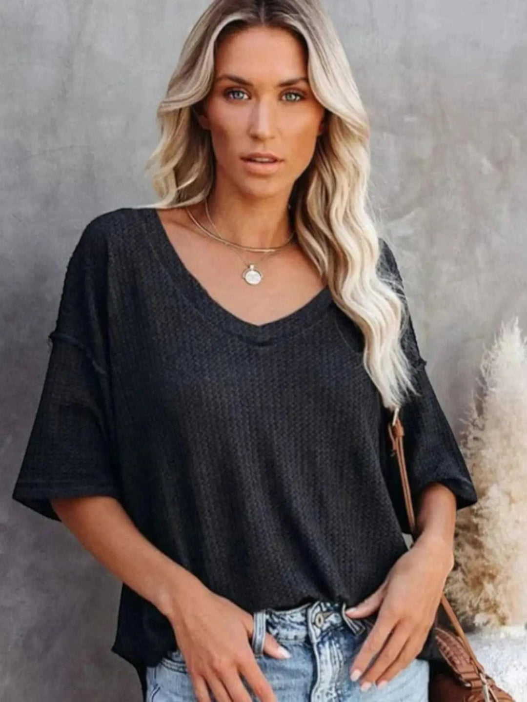 Woman wearing Black Oversized V-Neck Shirt with relaxed, V-neck | Lunova