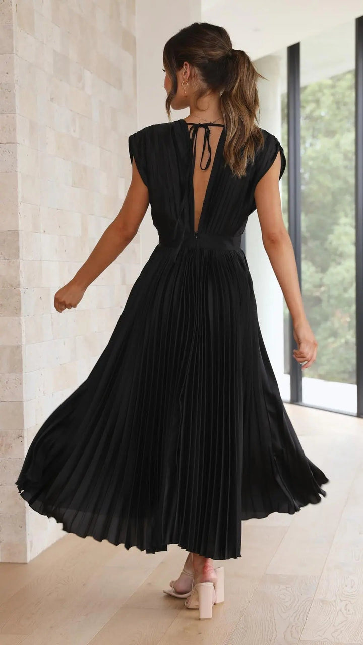 Woman wearing Pleated Maxi Dress with V-neck, high-waist — view 16 | Lunova
