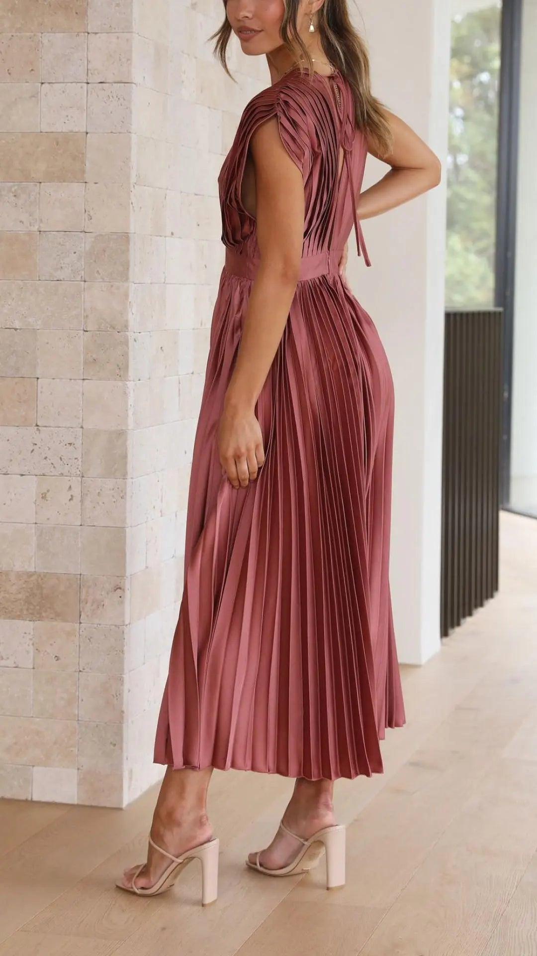 Woman wearing Pleated Maxi Dress with V-neck, high-waist — view 3 | Lunova