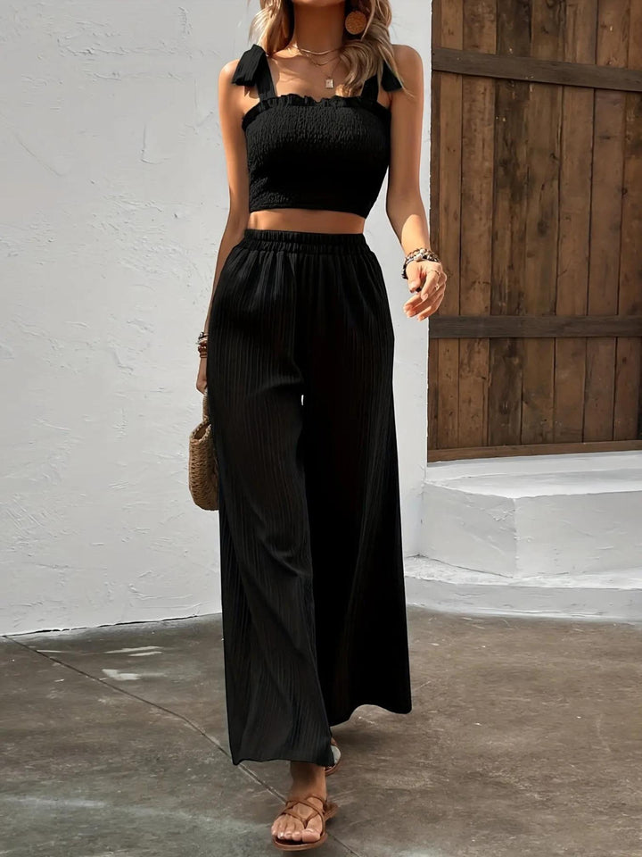 Woman wearing Black Pleated Two-Piece Set with wide-leg, high-waist | Lunova