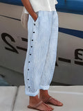 Woman wearing Light Blue Relaxed Fit Trousers with button-front, drawstring | Lunova