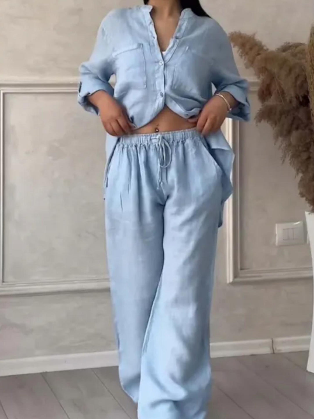 Woman wearing Light Blue Relaxed Two-Piece Set with button-front, drawstring | Lunova