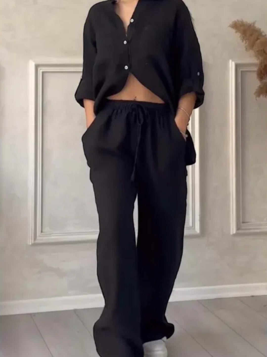 Woman wearing Black Relaxed Two-Piece Set with button-front, drawstring | Lunova