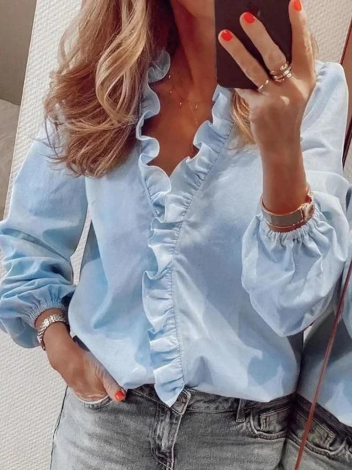 Woman wearing Blue Ruffle V-Neck Blouse with ruffled, button-front | Lunova