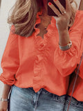 Woman wearing Orange Ruffle V-Neck Blouse with ruffled, button-front | Lunova