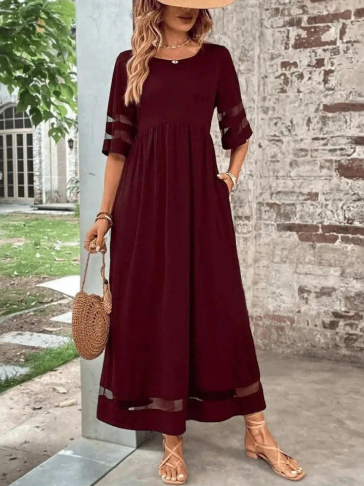 Woman wearing Red Sheer-Trim Maxi Dress with empire-waist, flowing | Lunova