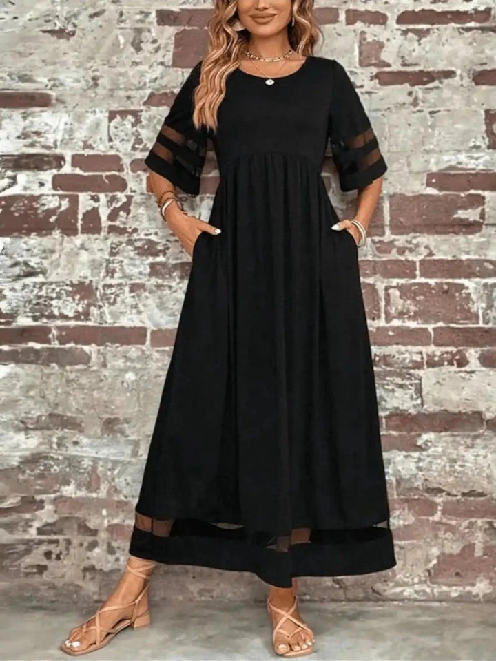 Woman wearing Sheer-Trim Maxi Dress with empire-waist, flowing | Lunova