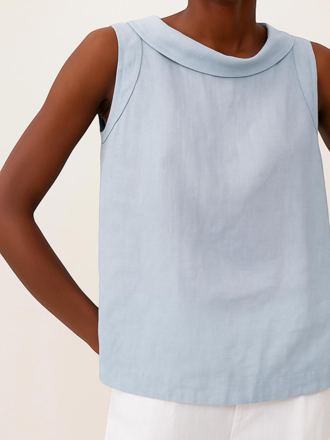 Woman wearing Sleeveless Roll Collar Top with relaxed, sleeveless | Lunova