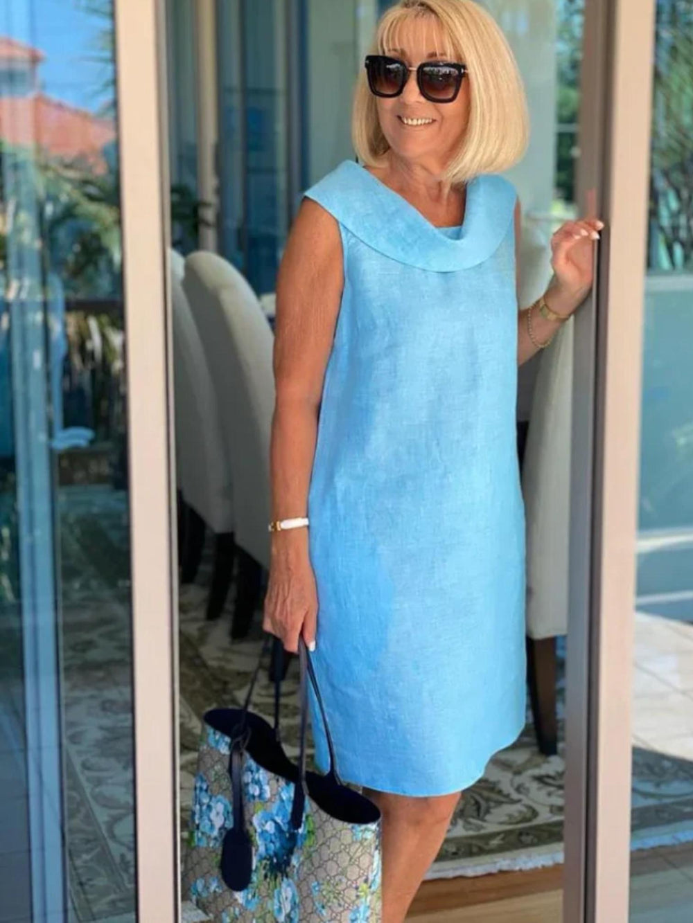 Woman wearing Light Blue Sleeveless Shift Dress with relaxed, sleeveless | Lunova