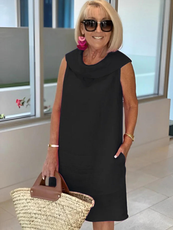 Woman wearing Black Sleeveless Shift Dress with relaxed, sleeveless | Lunova