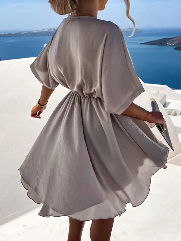 Woman wearing Surplice Mini Dress with A-line, wrap — view 7 | Lunova