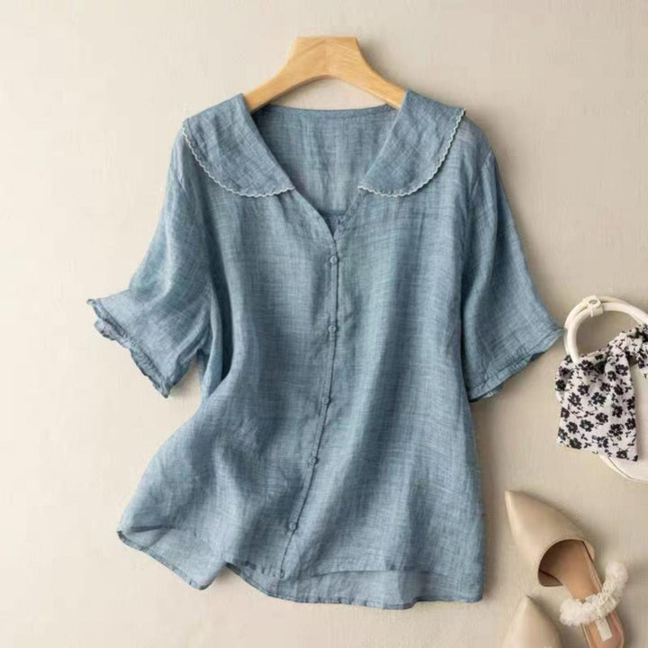 Woman wearing Blue Vintage Blouse with button-front, flowing | Lunova