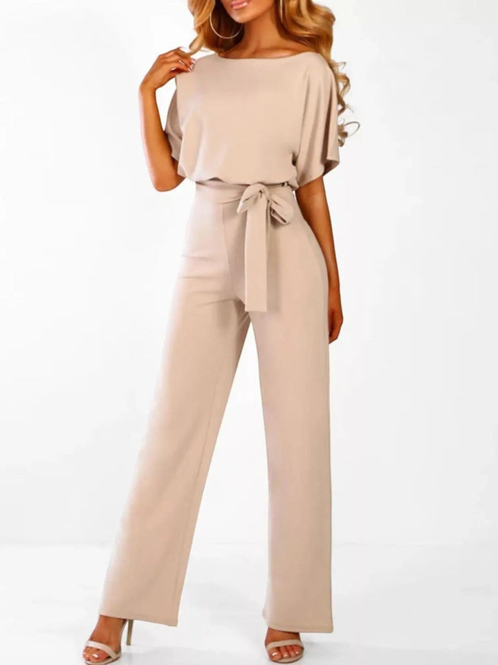 Woman wearing Beige Waist Tie Jumpsuit with full-length, wide-leg | Lunova