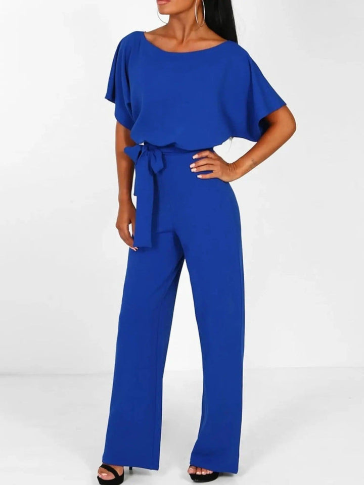 Woman wearing Blue Waist Tie Jumpsuit with full-length, wide-leg | Lunova