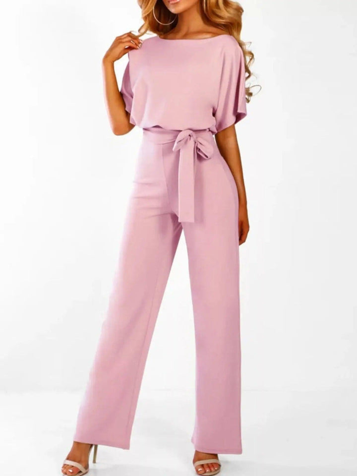 Woman wearing Pink Waist Tie Jumpsuit with full-length, wide-leg | Lunova