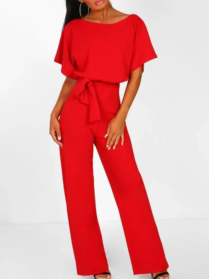 Woman wearing Red Waist Tie Jumpsuit with full-length, wide-leg | Lunova